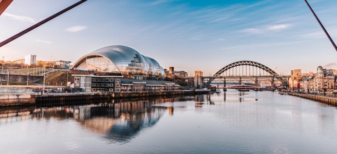 A picture on the River Tyne looking west from the Milennium Bridge. In the distance is The Glasshouse (formerly The Sage) and the Tyne Bridge - photo by Ryan Booth