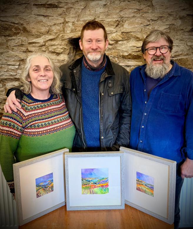 Carolyn and David Asquith with local artist Gordon Lamb, on the right
