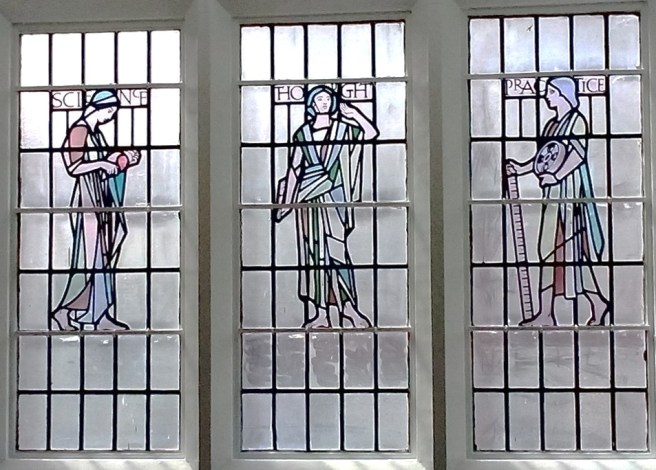 A three panel stained glass window by George Hatton at Newcastle University